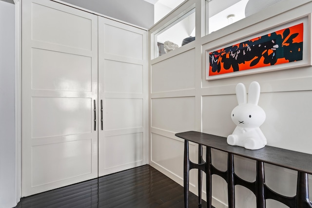 walk in closet featuring dark wood-type flooring