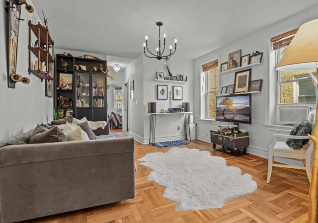 living area featuring a chandelier and baseboards