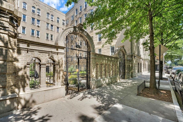 surrounding community with a gate and fence