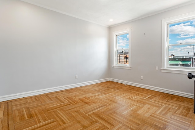 unfurnished room with baseboards and crown molding