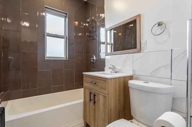 full bathroom with tile walls, toilet, decorative backsplash, bathing tub / shower combination, and vanity