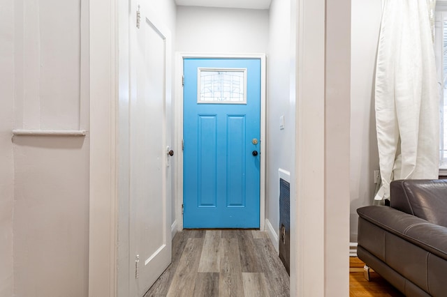 doorway featuring wood finished floors