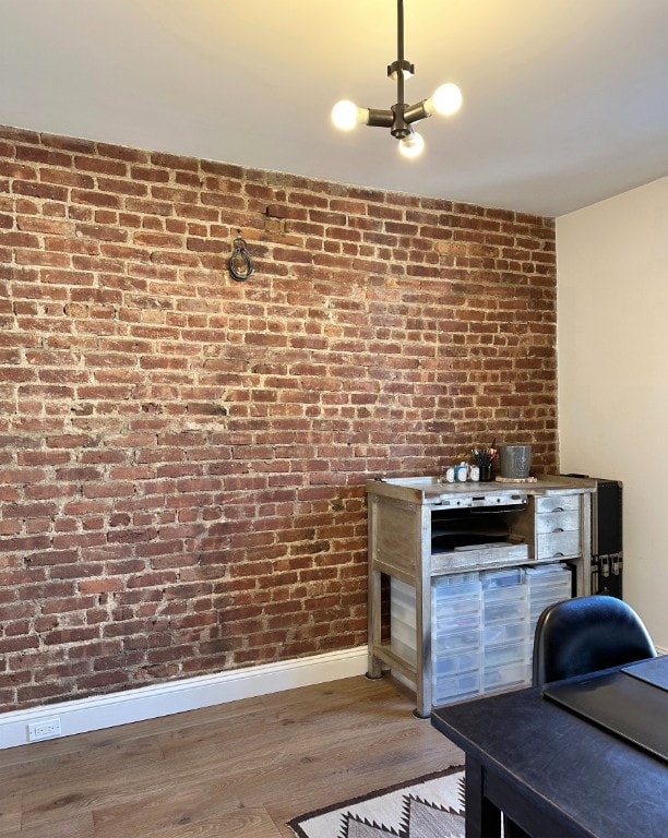 interior space featuring baseboards and wood finished floors