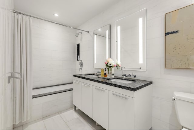 230 E 20th St Unit 13, New York City, NY 10003 - bathroom with double vanity, recessed lighting, and tile patterned floors