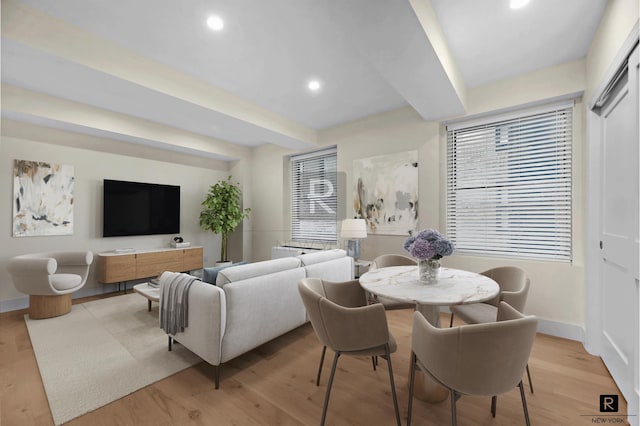 dining area with beam ceiling, recessed lighting, light wood-type flooring, and baseboards