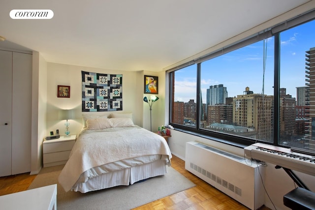 bedroom featuring radiator and visible vents