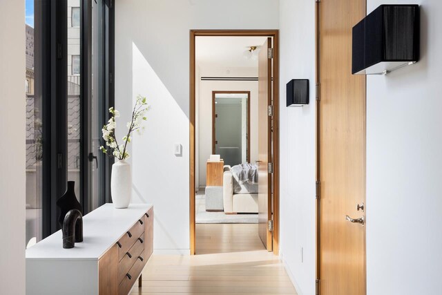 hallway with light wood-style flooring