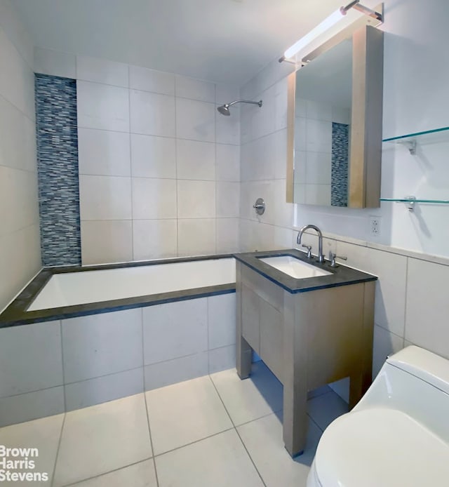 full bath featuring tile walls, toilet, a sink, tiled shower, and tile patterned floors