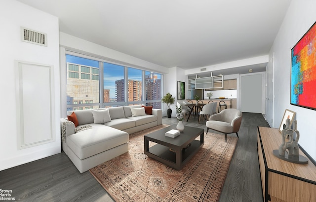 living area with dark wood-style floors, visible vents, and a city view