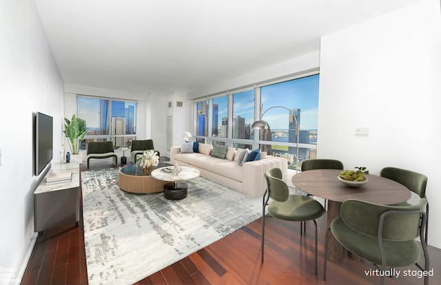 living area featuring a view of city and wood finished floors