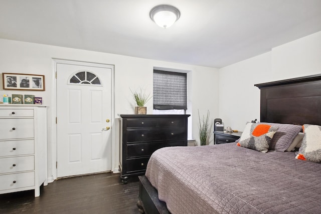 bedroom featuring dark wood-style flooring