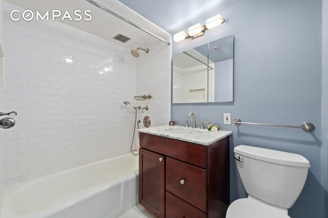 full bathroom featuring toilet, shower / bathtub combination, vanity, and visible vents