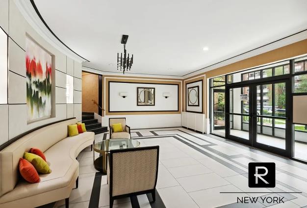 100-11 67th Rd Unit 106, New York City, NY 11375 - lobby with crown molding, stairway, and recessed lighting