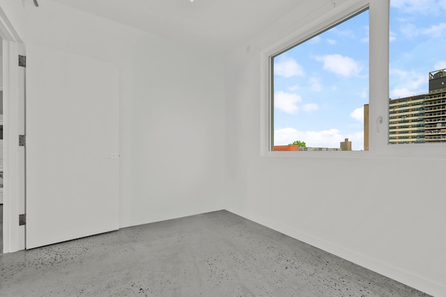 spare room featuring concrete floors