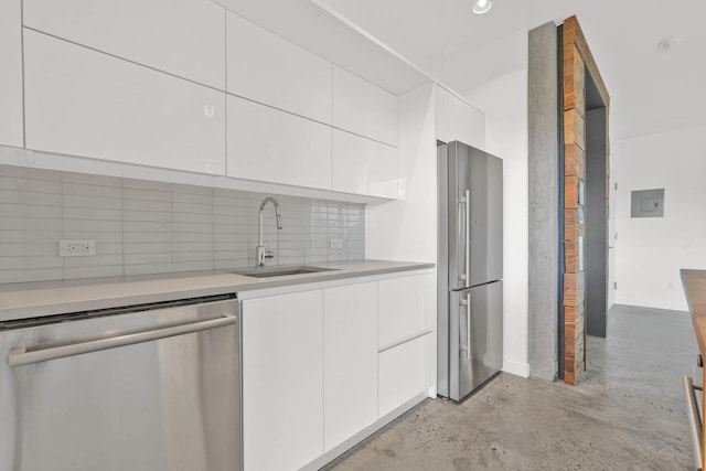 kitchen featuring a sink, appliances with stainless steel finishes, modern cabinets, and white cabinets