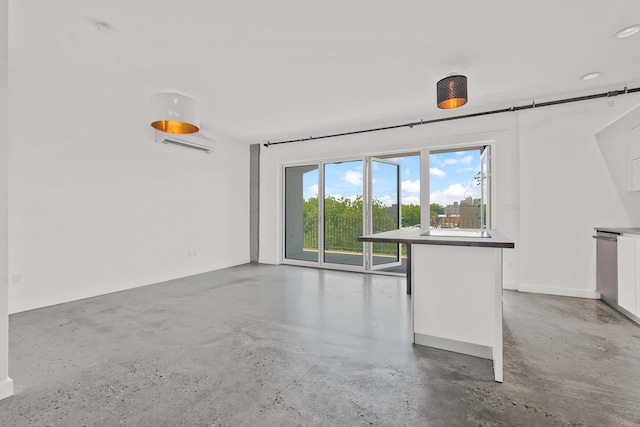 unfurnished living room with concrete floors