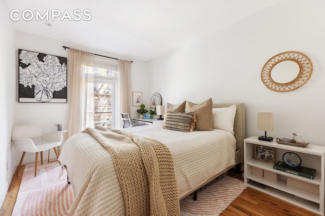 bedroom featuring wood finished floors