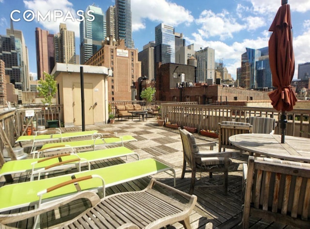 wooden terrace with a city view