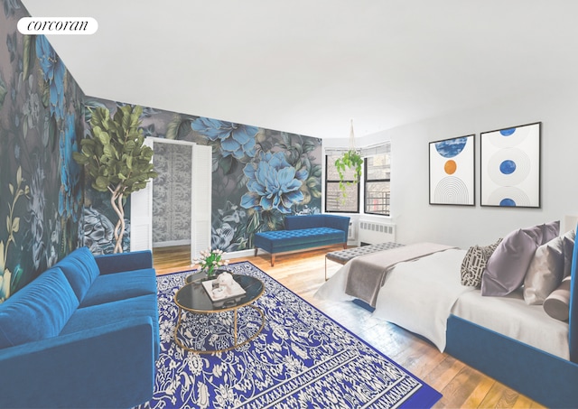 bedroom featuring wallpapered walls, radiator, wood finished floors, and baseboards