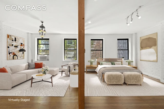 118 Suffolk St Unit 3Ab, New York City, NY 10002 - bedroom featuring hardwood / wood-style floors, baseboards, and cooling unit