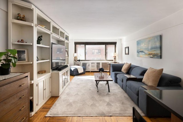 living area featuring light wood-style flooring