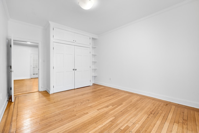 131 E 29th St, New York City, NY 10016 - unfurnished bedroom featuring light wood-style floors, ornamental molding, and a closet