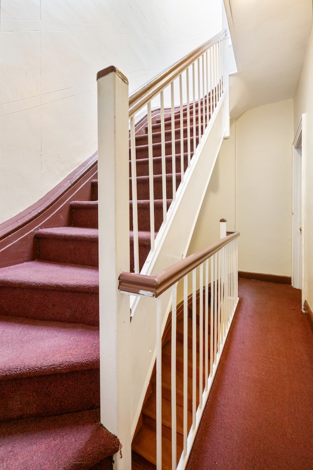 131 E 29th St, New York City, NY 10016 - staircase with carpet flooring and baseboards