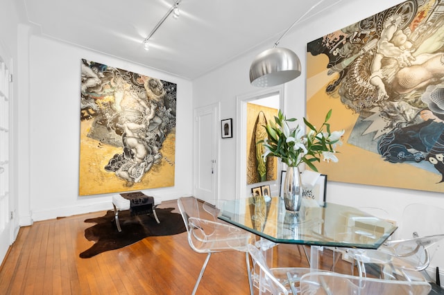 131 E 29th St, New York City, NY 10016 - dining room featuring rail lighting and hardwood / wood-style flooring