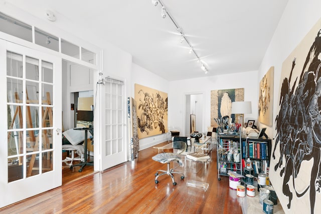 131 E 29th St, New York City, NY 10016 - office space with track lighting, french doors, and wood finished floors