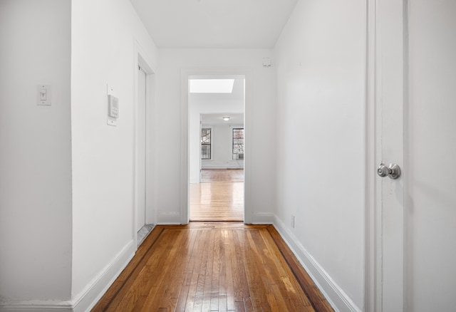 131 E 29th St, New York City, NY 10016 - hallway with wood-type flooring and baseboards