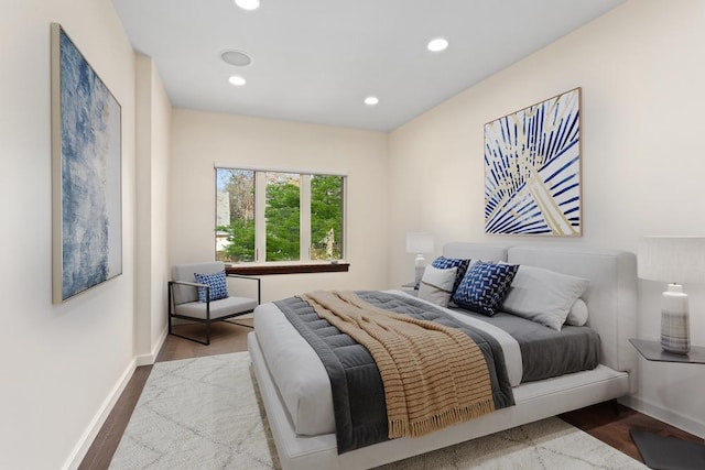 bedroom featuring recessed lighting, wood finished floors, and baseboards