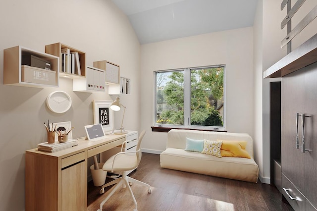 office space with baseboards, lofted ceiling, and dark wood-style floors