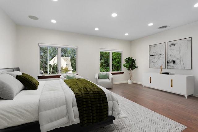 bedroom featuring visible vents, recessed lighting, baseboards, and wood finished floors