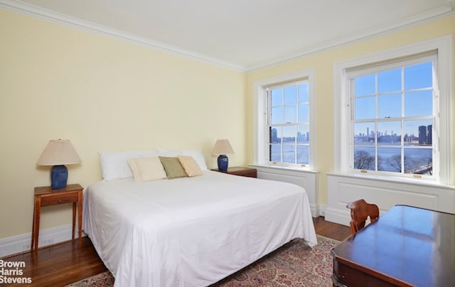1 Beekman Pl Unit 7/8A, New York City, NY 10022 - bedroom with crown molding, wood finished floors, and baseboards