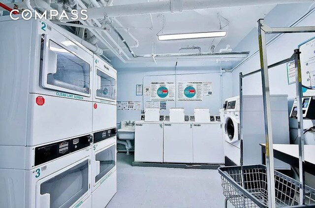 community laundry room with washer and dryer and stacked washing maching and dryer