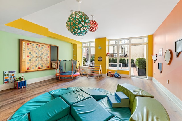 205 E 85th St Unit 8L, New York City, NY 10028 - game room featuring wood finished floors and baseboards