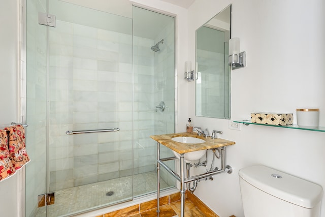 full bathroom with a shower stall and toilet