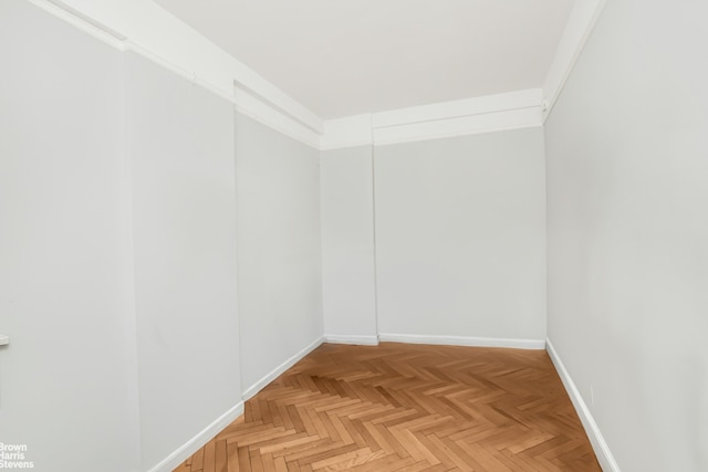 empty room featuring baseboards