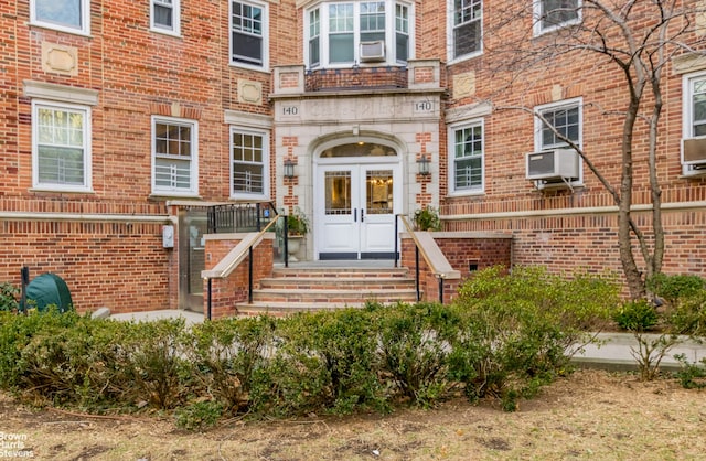 property entrance featuring french doors and cooling unit