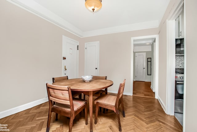 dining space featuring baseboards