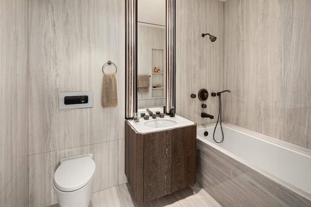 bathroom featuring vanity, toilet, and shower / bath combination