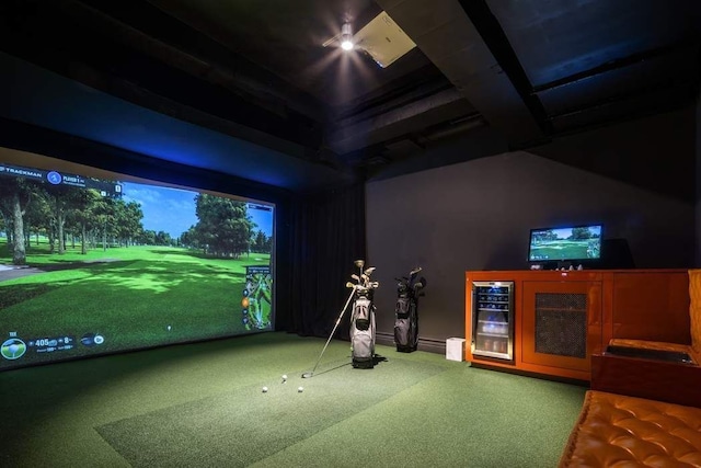 playroom with wine cooler, carpet floors, and golf simulator