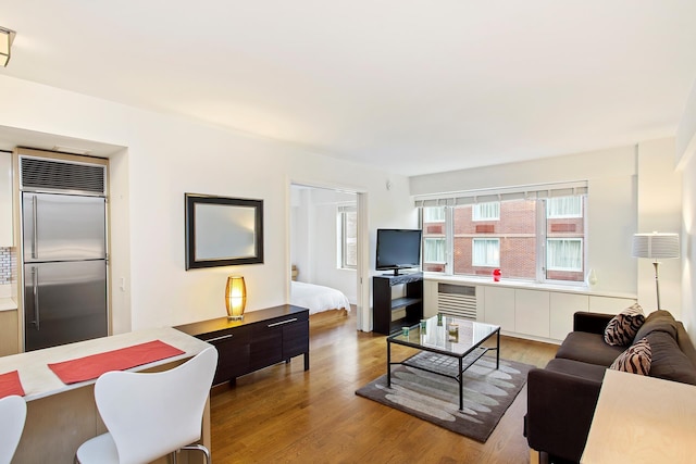 living room with wood finished floors