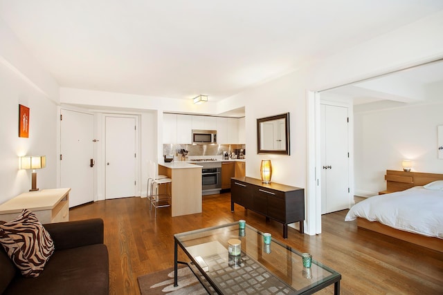 living room featuring dark wood-style flooring