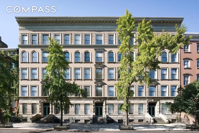 view of apartment building / complex with entry steps