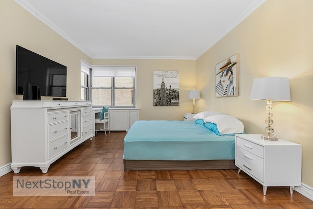 bedroom with baseboards and ornamental molding