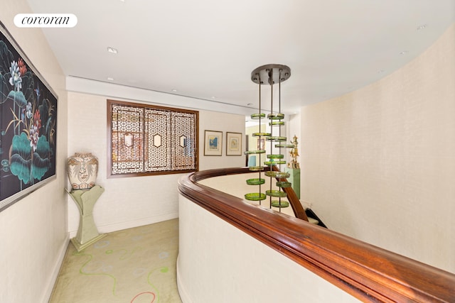 hallway featuring visible vents and baseboards