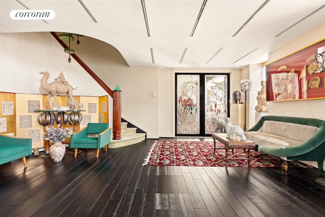 interior space featuring visible vents, stairway, french doors, and hardwood / wood-style flooring