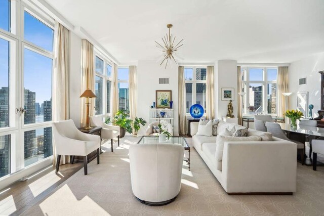 interior space with visible vents and an inviting chandelier