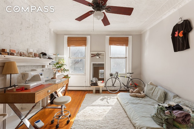 interior space featuring wood finished floors and ornamental molding